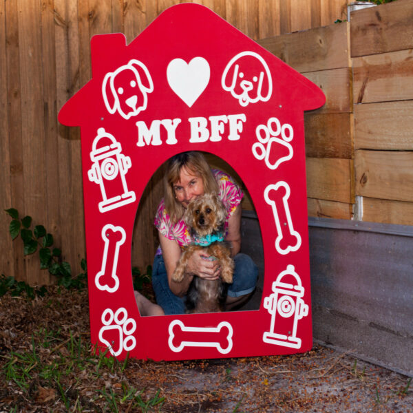 Red Doghouse Photo-Op woman w/ little dog