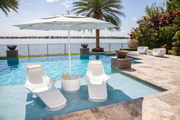 Shayz in pool Lounger with Ripple Wide Table Moon Chairs in Back