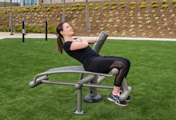 person using Outdoor Sit up/ Back Extension machine