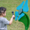 Child Playing Turquoise Musical Flower