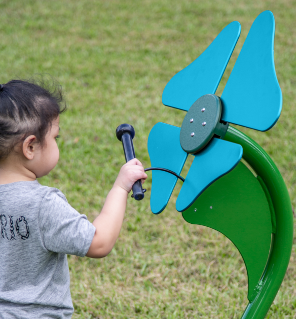 Child Playing Turquoise Musical Flower